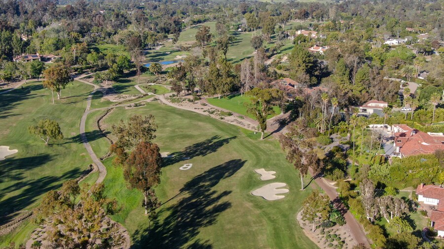 Aerial view of a beautiful wealthy green golf course next the valley. San Diego, California. USA.