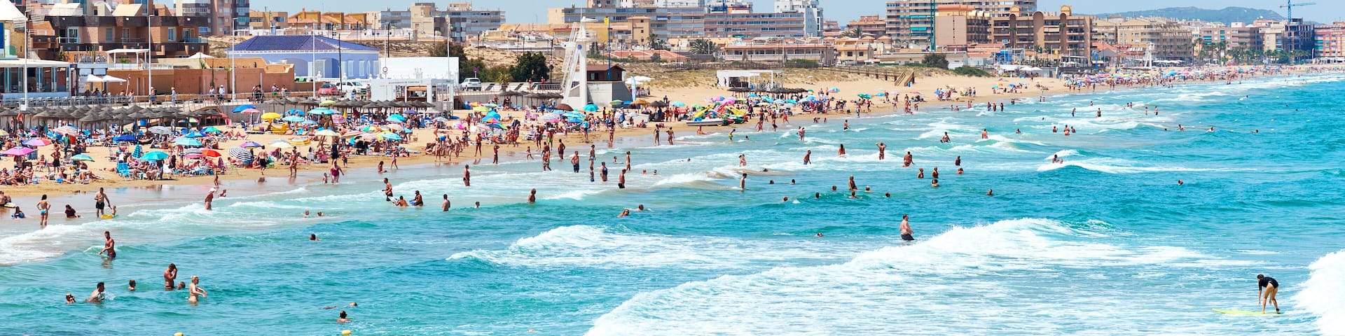 Crowd of people on the beach of La Mata. Costa Blanca. Spain