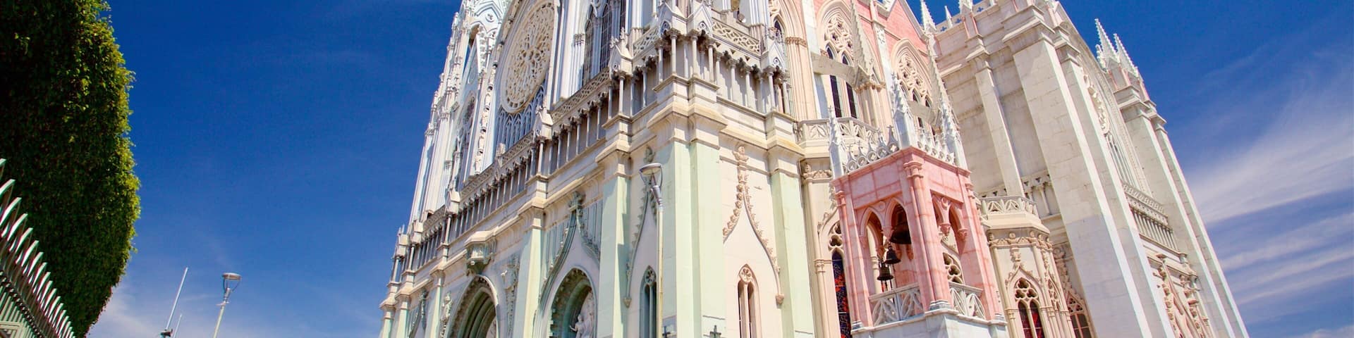 A large, ornate cathedral with intricate architecture and a clock tower.