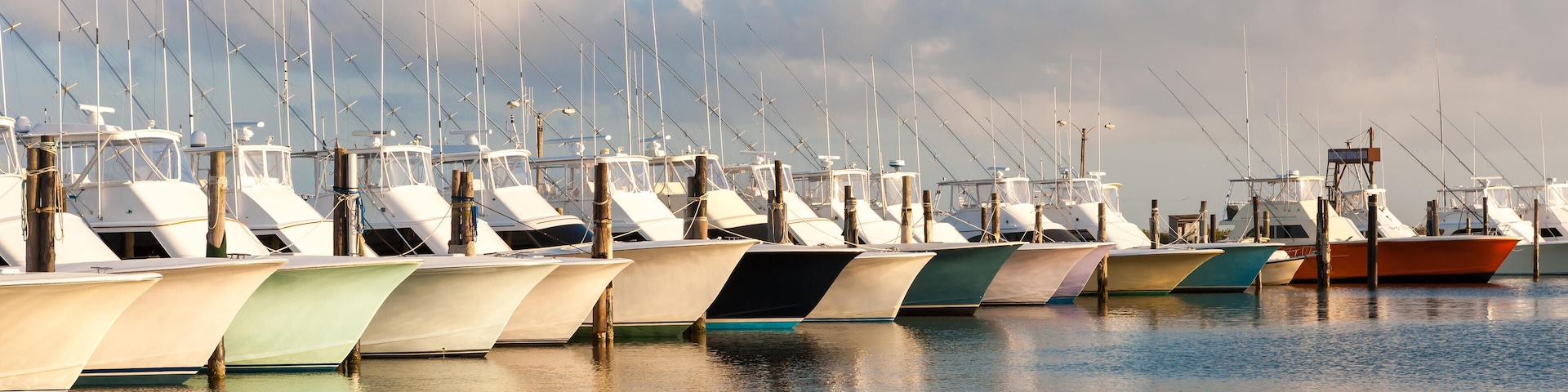 EX35KC A fleet of charter fishing boats docked at the marina of the Oregon Inlet Fishing Center in Nags Head, North Carolina.
