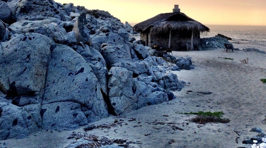The stone sleeping cabin. Spectacular place to cozy up for a night on the beach. Complete with wood for bonfire, solar power, stove for AM coffee, and waves crashing at your door. A most hidden gem, off the grid. About $150/night.