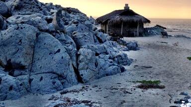 The stone sleeping cabin. Spectacular place to cozy up for a night on the beach. Complete with wood for bonfire, solar power, stove for AM coffee, and waves crashing at your door. A most hidden gem, off the grid. About $150/night.
