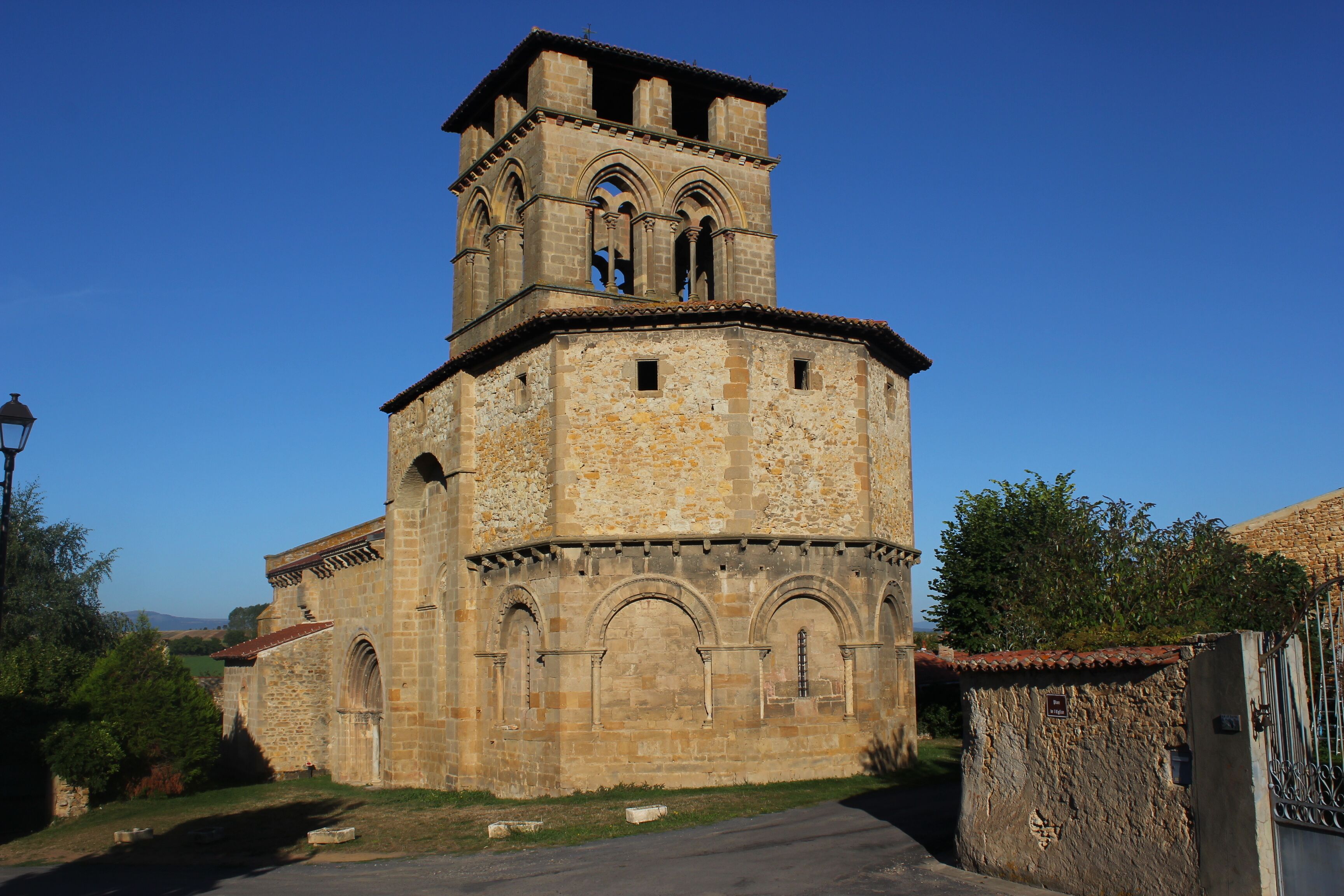 A historic stone tower with arched windows and a bell tower.