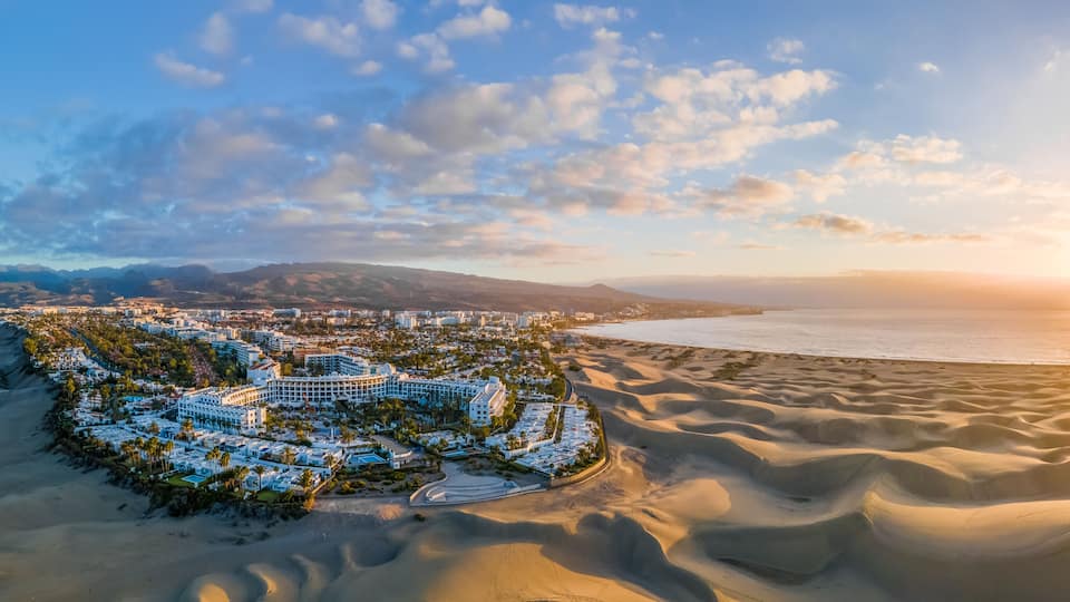 Landscape with Maspalomas town and golden sand dunes at sunrise, Gran Canaria, Canary Islands, Spain