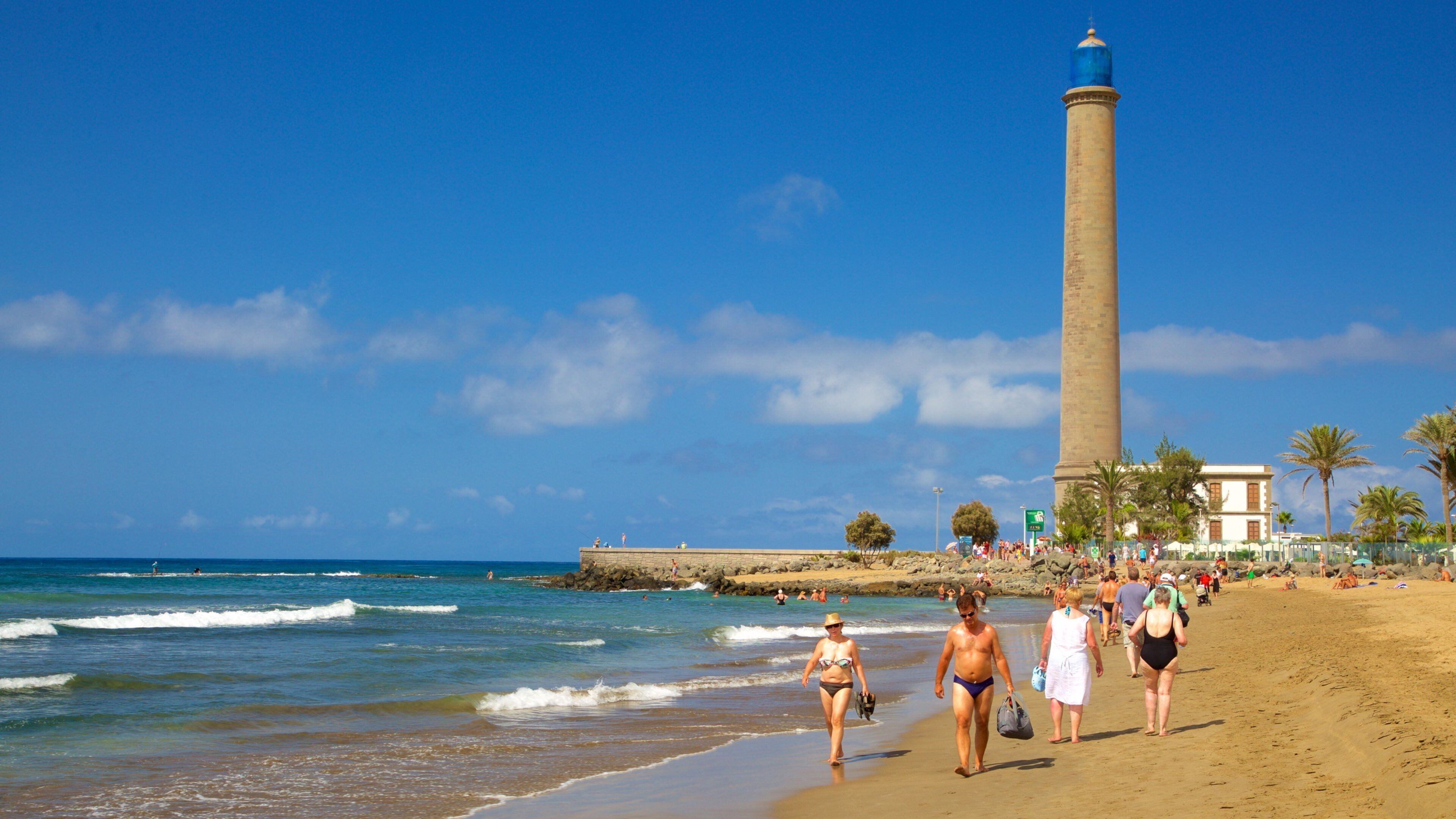 Maspalomas Lighthouse showing general coastal views, a sandy beach and a lighthouse