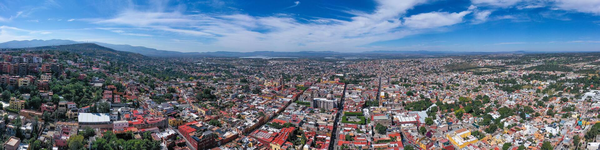 Aerial: scenic cityscape and landscape in San Miguel de Allende, Mexico. Drone view