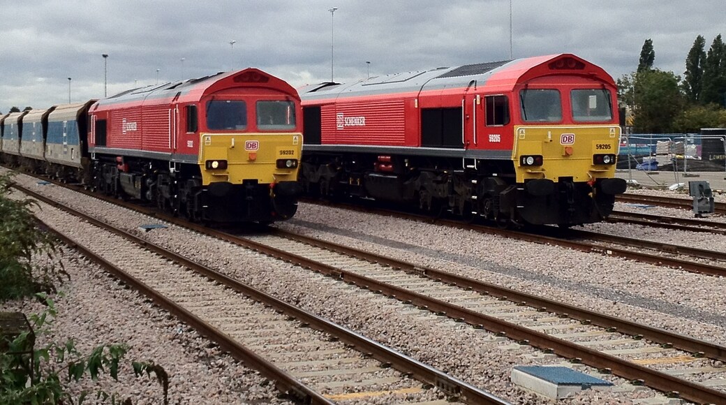 British Rail class 59 locomotives 59 202 and 59 205 in the freight sidings adjacent to Acton Main Line railway station, London. The locomotives are in DB Schenker livery.