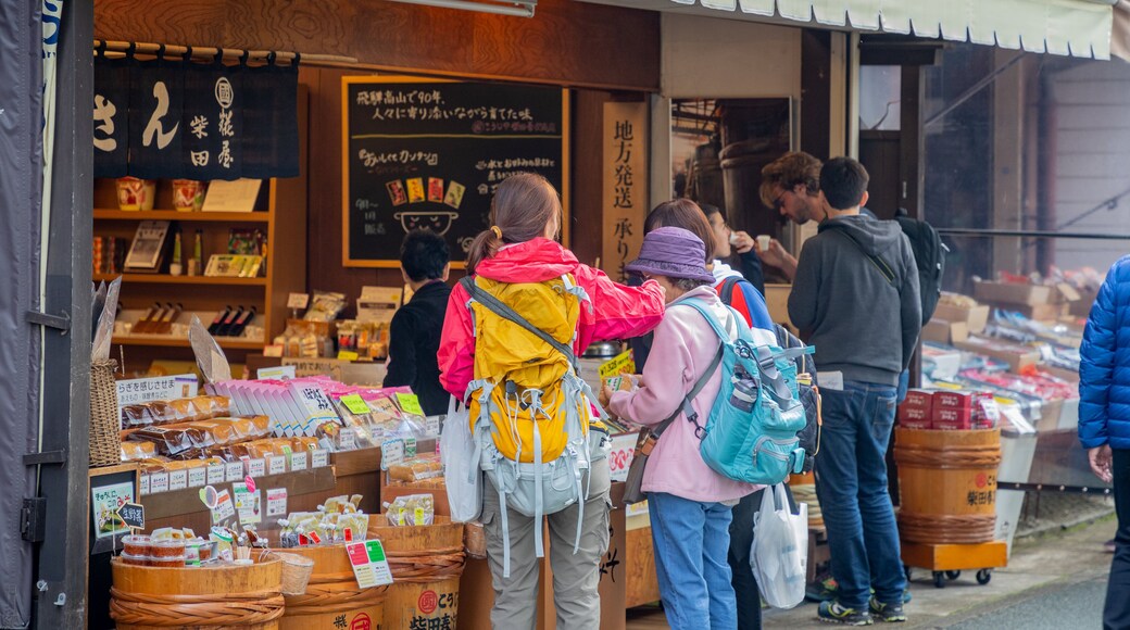 Miyagawa Morning Market showing street scenes as well as a small group of people