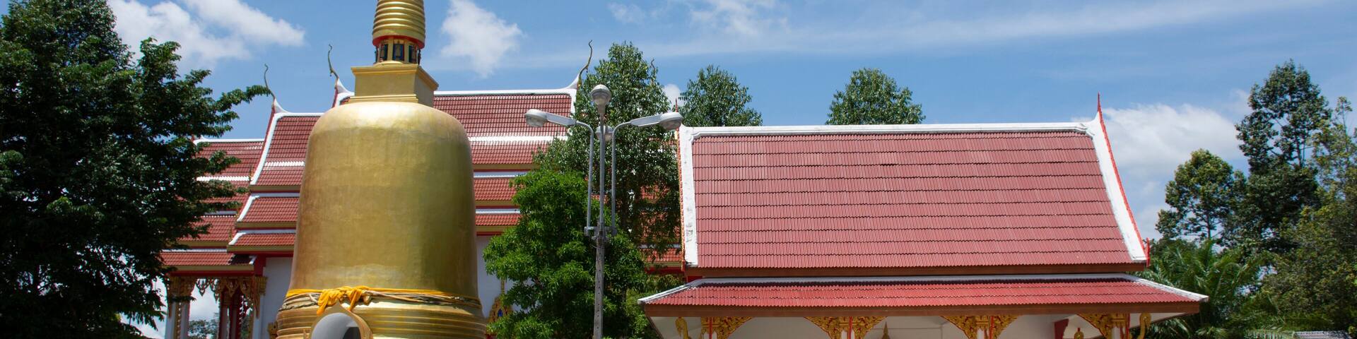 Building and stupa or chedi for thai people and foreigner travelers travel visit and respect praying god angel buddha statue at Wat Klong Thom or Khlong Thom Temple in Krabi, Thailand