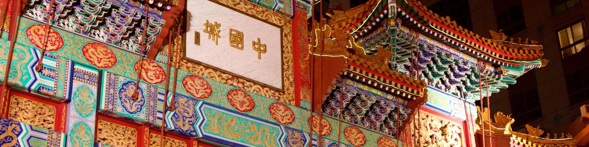 Chinatown featuring outdoor art, signage and night scenes