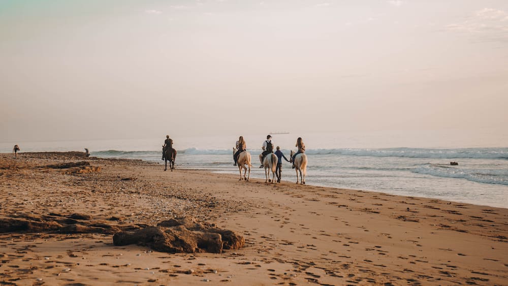 Sunset over Devil's Rock at Surfer Point in Tamraght, Morocco