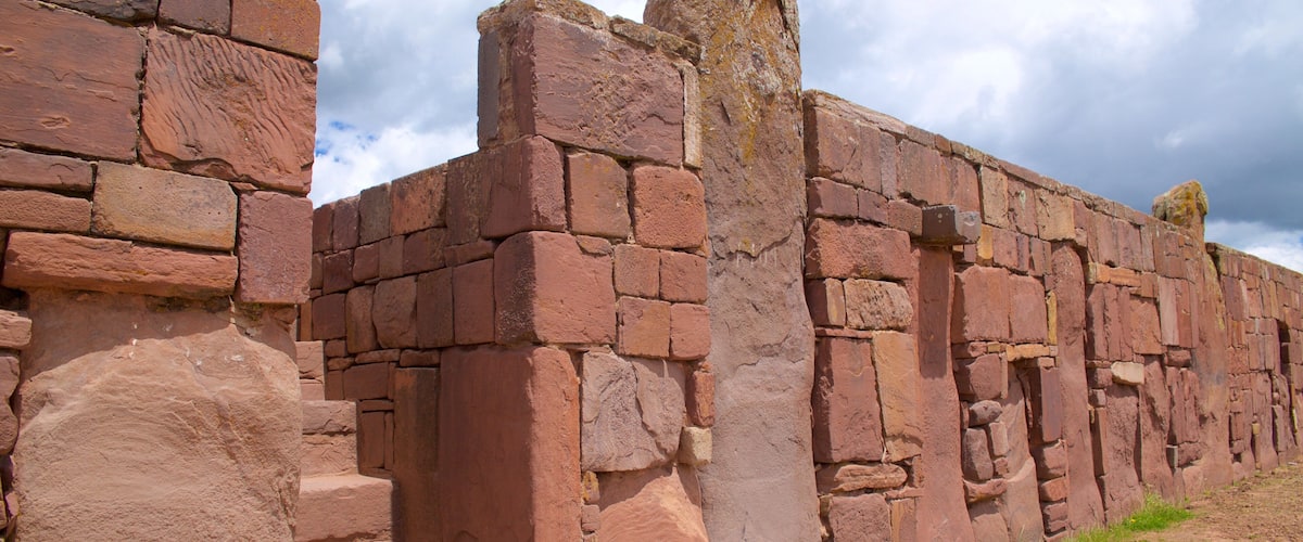 Ancient red brick ruins with stone steps and a stone wall.