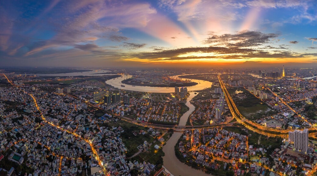 Top view aerial of Mai Chi Tho road, Thu Thiem peninsula and center Ho Chi Minh City, Vietnam with development buildings, transportation, energy power infrastructure. View from District 2
