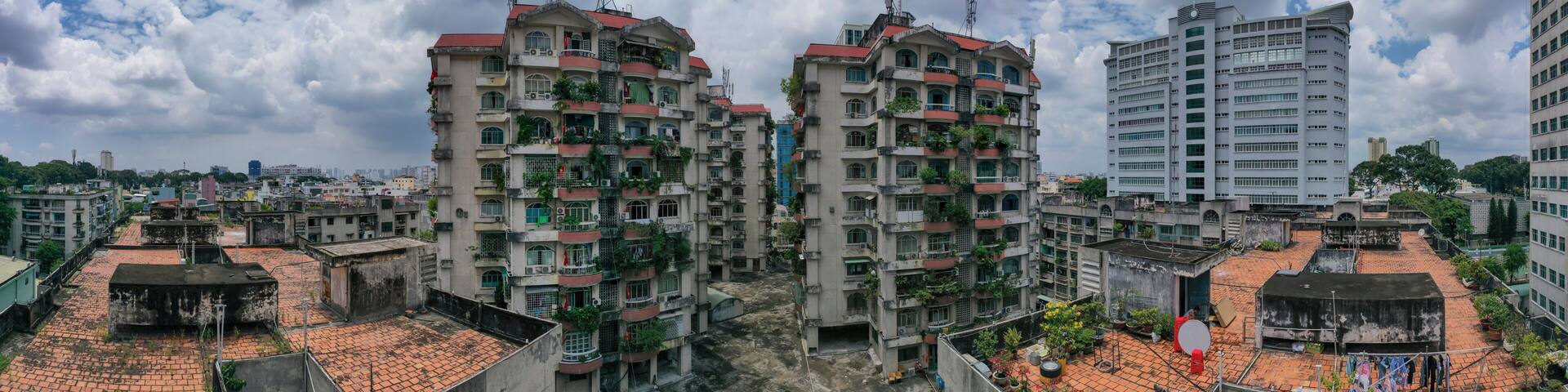 Old communist ,brutalist apartment building in Cho lon or Chinatown district of Ho Chi Minh City, Vietnam. Panorama of surrounding area