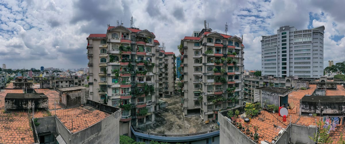 Old communist ,brutalist apartment building in Cho lon or Chinatown district of Ho Chi Minh City, Vietnam. Panorama of surrounding area