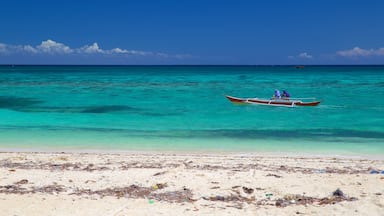 Guimbitayan Beach showing a sandy beach and general coastal views