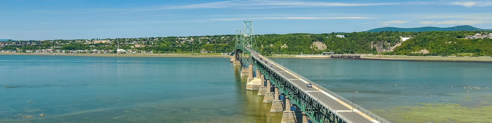 Ile d\'Orleans which includes a river or creek and a bridge