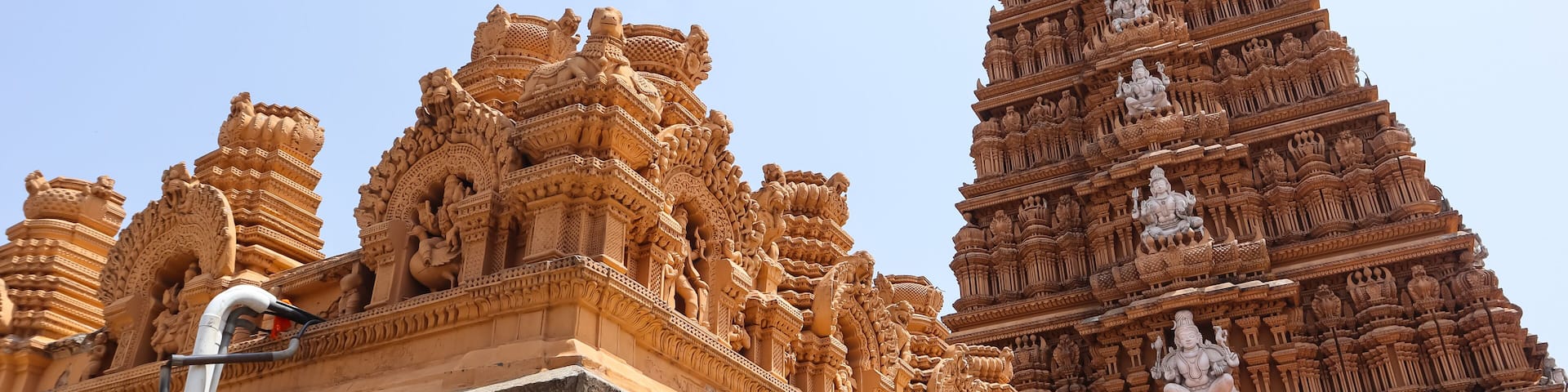 Intricate temple architecture with detailed carvings and statues.
