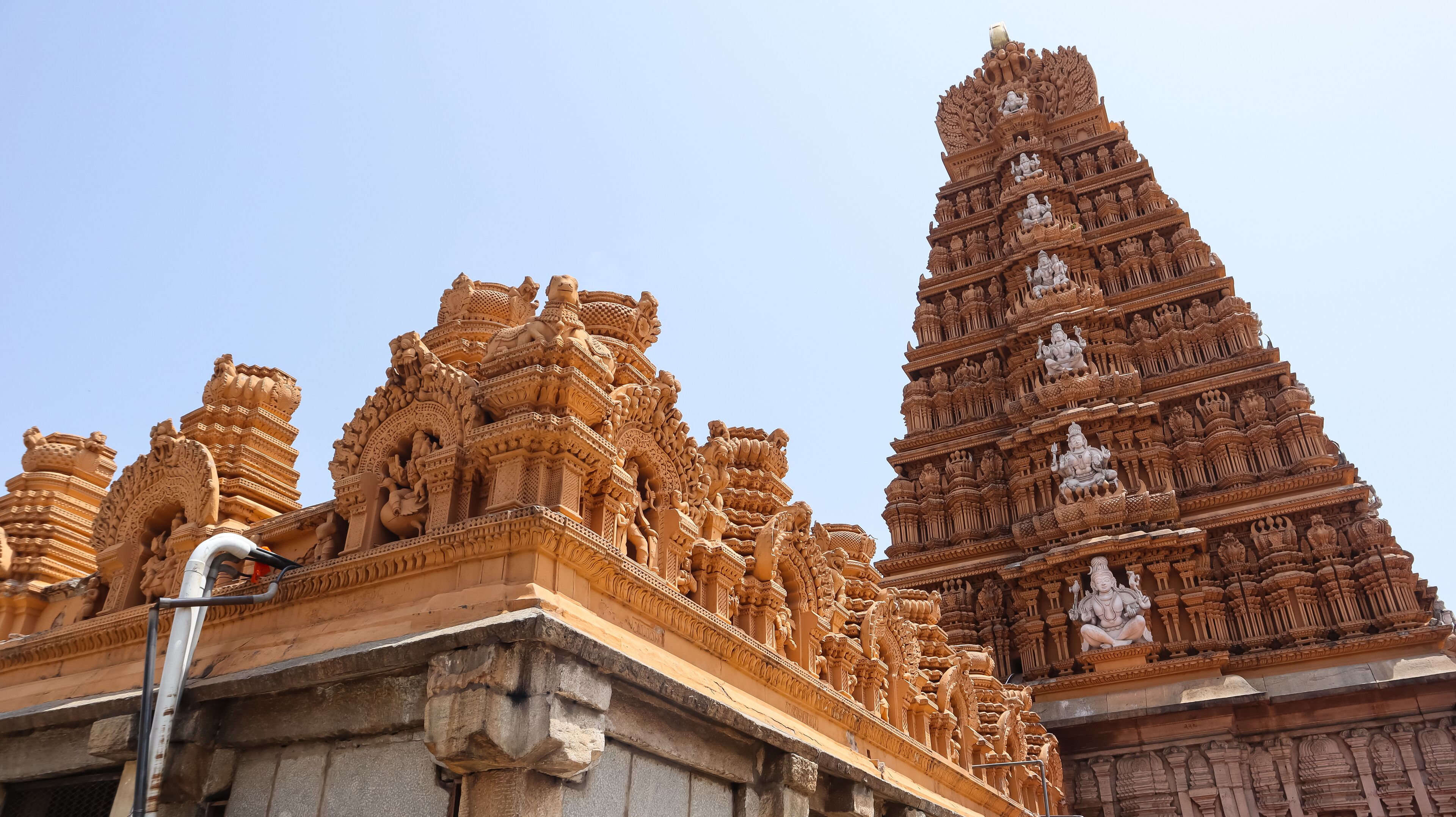 Intricate temple architecture with detailed carvings and statues.