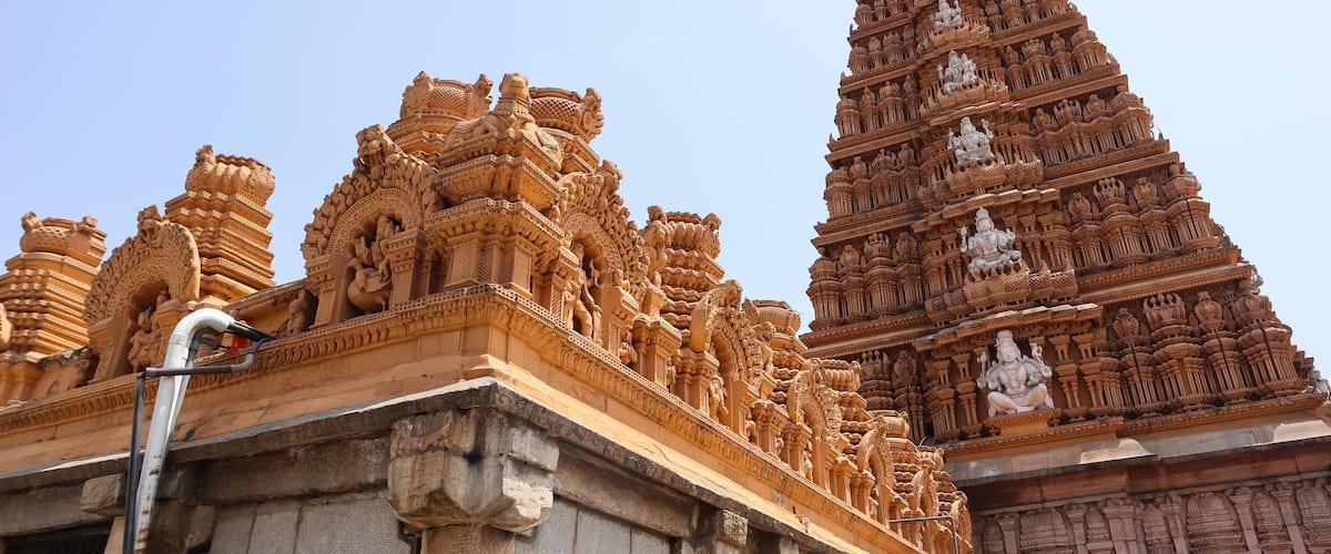 Intricate temple architecture with detailed carvings and statues.