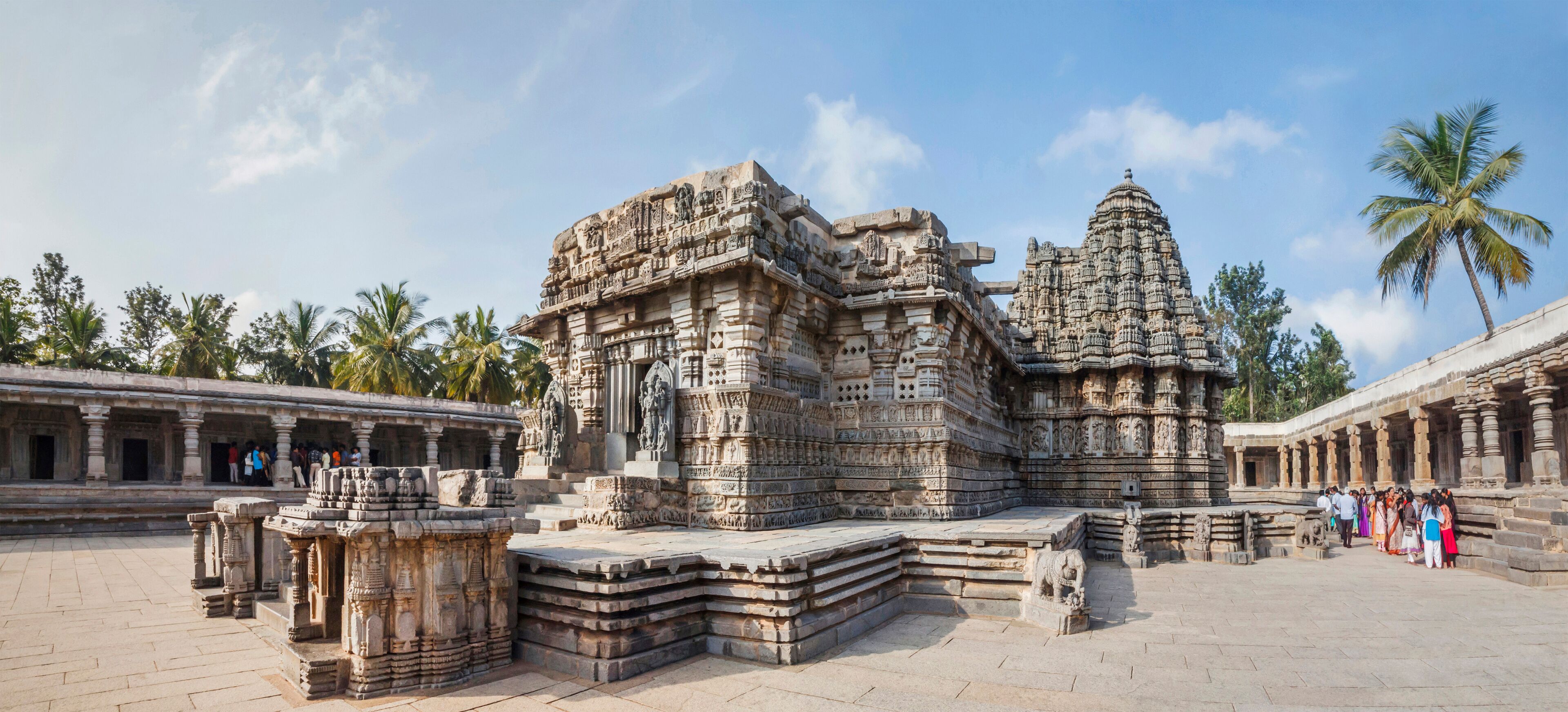An ancient temple complex with intricate carvings and a large central structure.