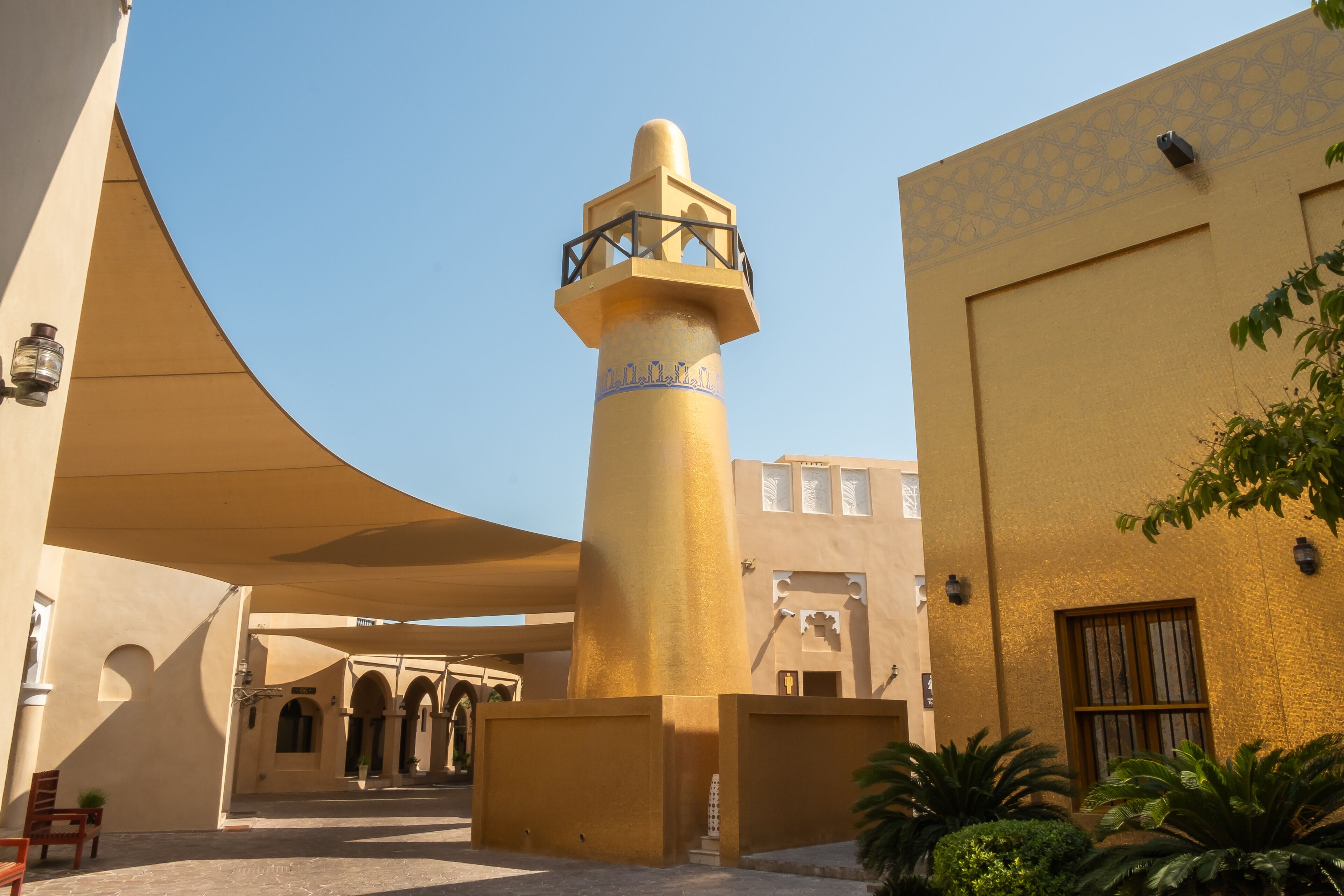 View of mosque tower at Katara cultural village, a waterfront area with an amphitheater, museum and also as convention center and eateries shop, where is nearby the Karata beach, in Doha, Qatar.
