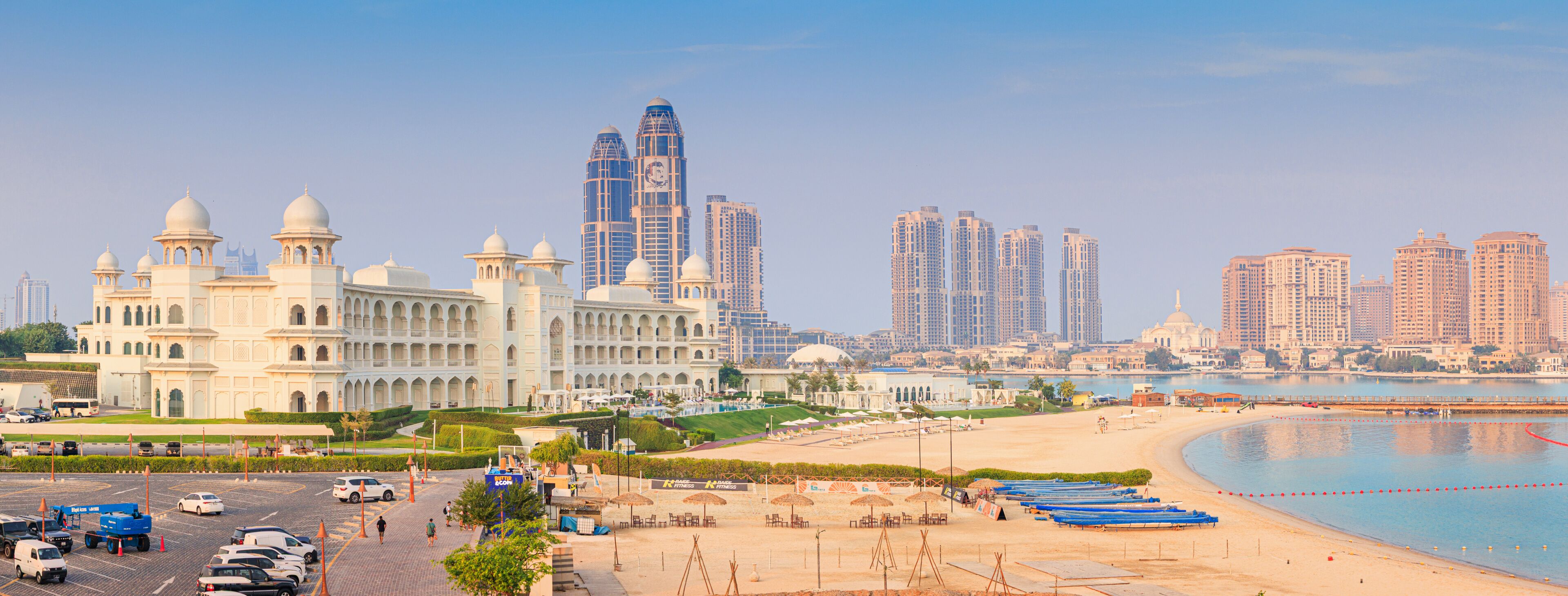 1 December 2025, Doha, Qatar: Katara cultural village traditional architecture with beach and modern city skyline