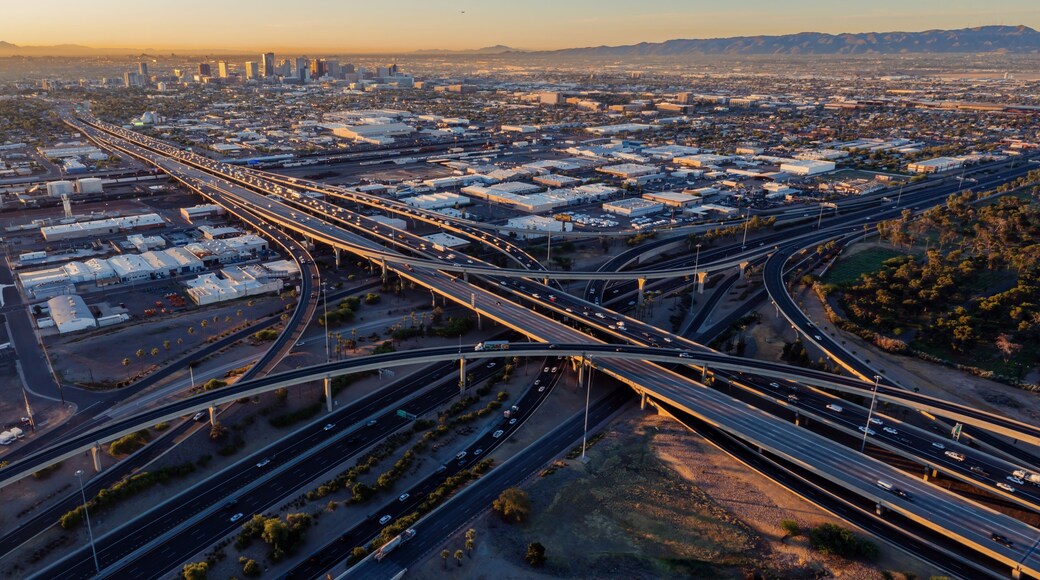 Interstate Freeway junction and rush hour traffic at sunrise. Maryvale, Phoenix, Arizona, United States of America.