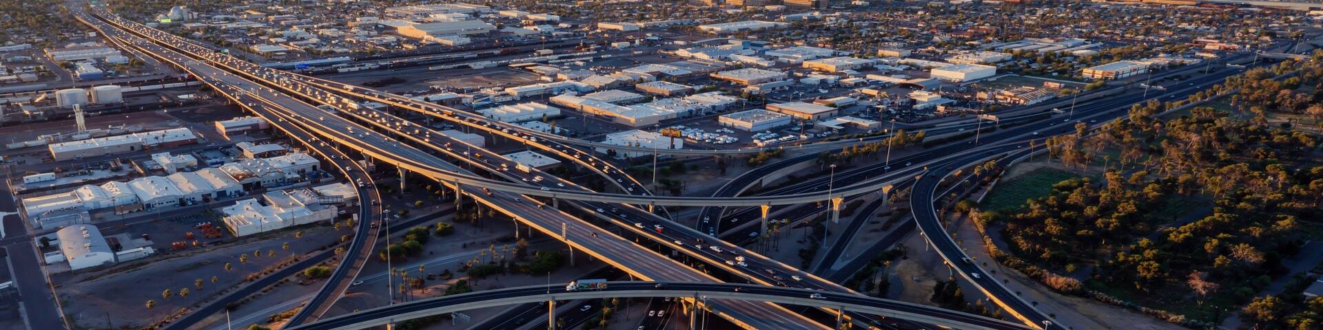 Interstate Freeway junction and rush hour traffic at sunrise. Maryvale, Phoenix, Arizona, United States of America.