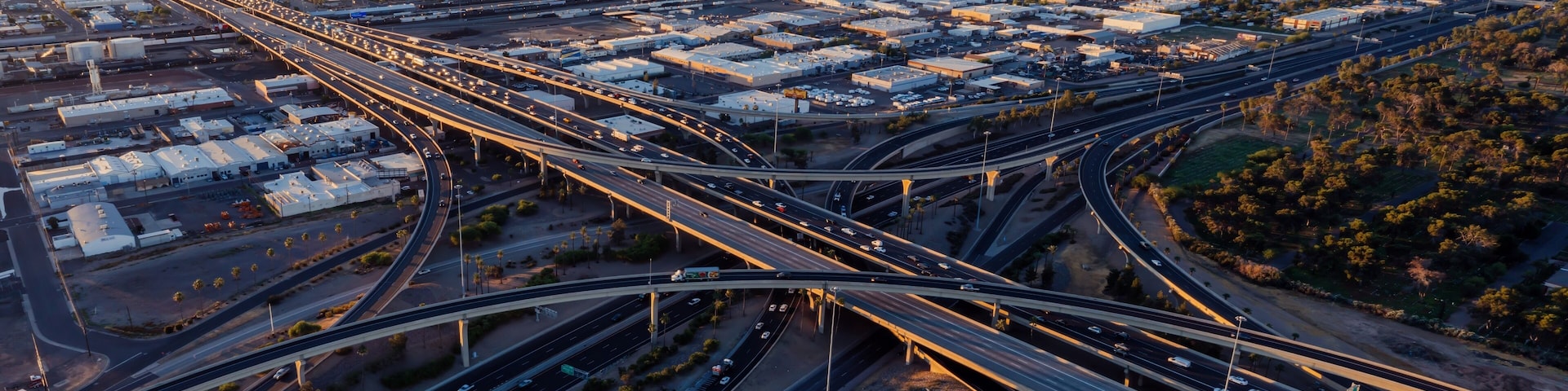 Interstate Freeway junction and rush hour traffic at sunrise. Maryvale, Phoenix, Arizona, United States of America.