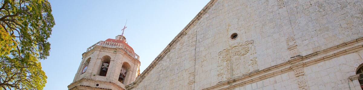 Dalaguete Church which includes a sunset, religious aspects and a church or cathedral