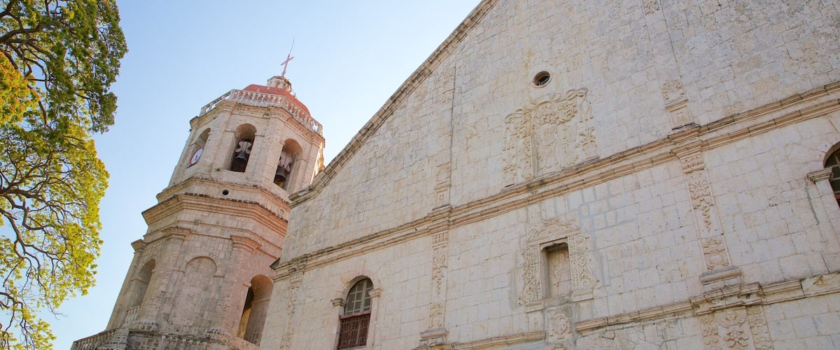 Kerk van Dalaguete bevat een kerk of kathedraal, religieuze elementen en een zonsondergang