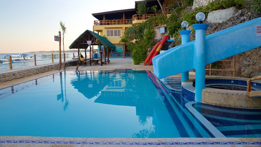 Dalaguete Beach showing a pool and a sunset