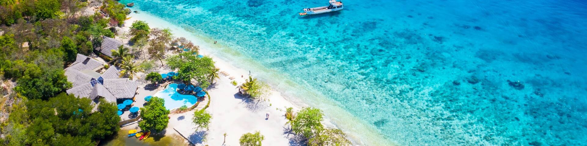 Panorama with a aerial top view as perspective of the Sumilon island beach landing near Oslob, Cebu, Philippines.
