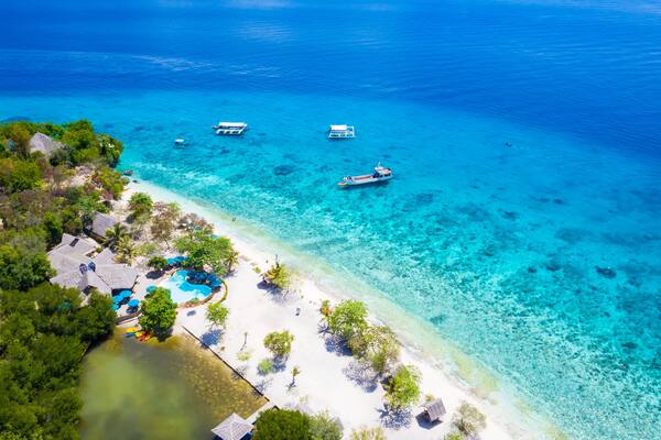 Panorama with a aerial top view as perspective of the Sumilon island beach landing near Oslob, Cebu, Philippines.