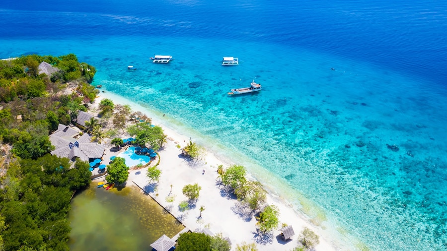 Panorama with a aerial top view as perspective of the Sumilon island beach landing near Oslob, Cebu, Philippines.
