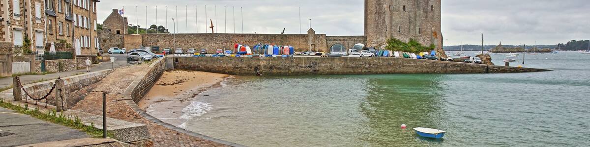 Solidor Tower located in the estuary of the river Rance in Saint Servan with Saint Pere beach in the foreground, Saint Malo, Brittany, France