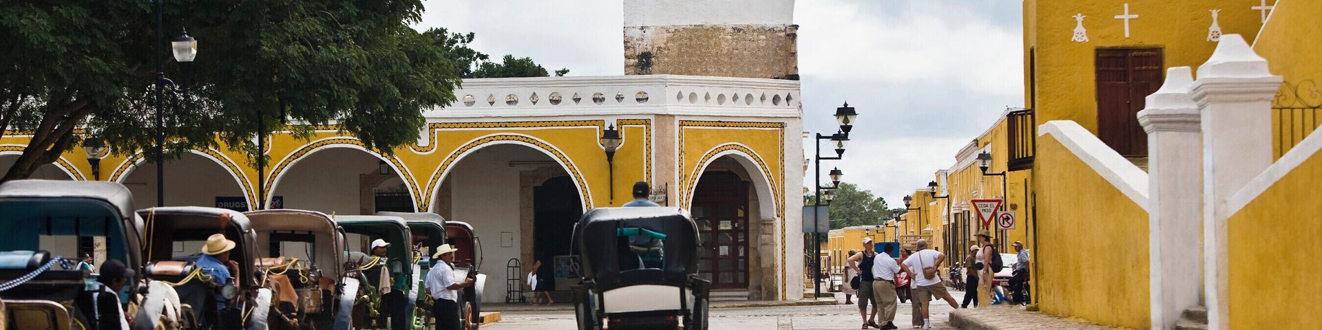 Horse carts in front of a church, Convento De San Antonio De Padua, Izamal, Yucatan, Mexico