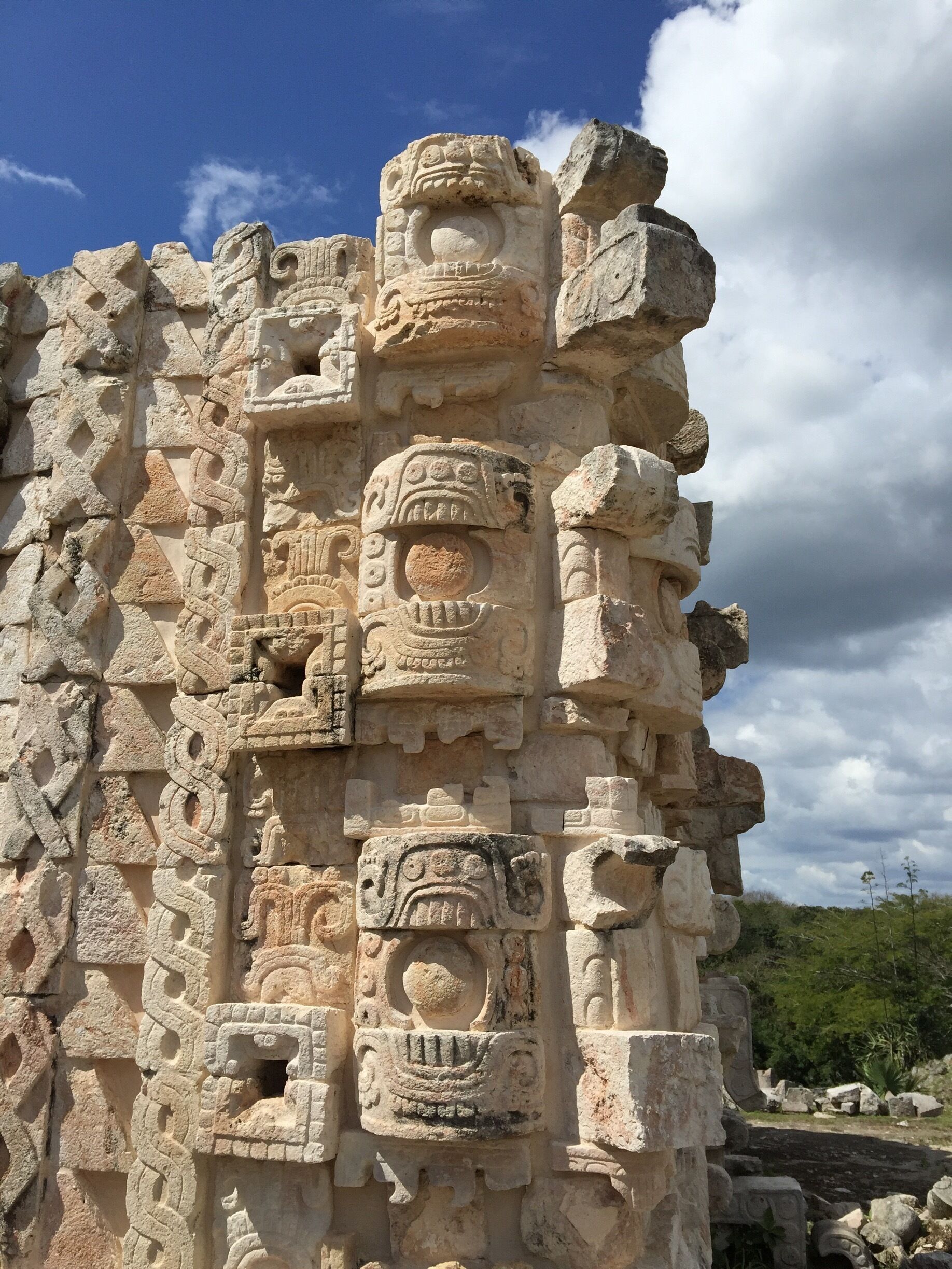 Ancient stone carvings with intricate designs and circular motifs.