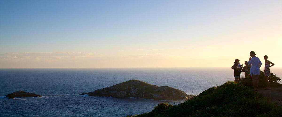 Atalaia Viewpoint showing landscape views, a sunset and general coastal views
