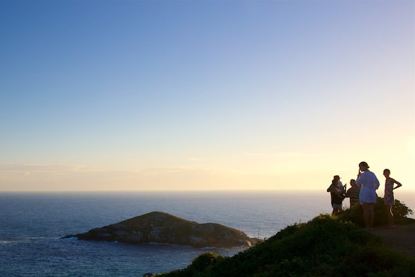 Atalaia Viewpoint which includes island views, a sunset and general coastal views
