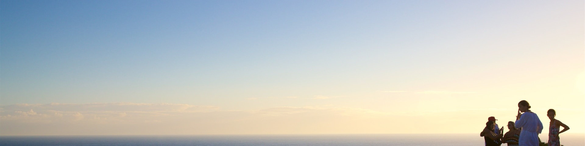 Atalaia Viewpoint which includes island images, a sunset and landscape views