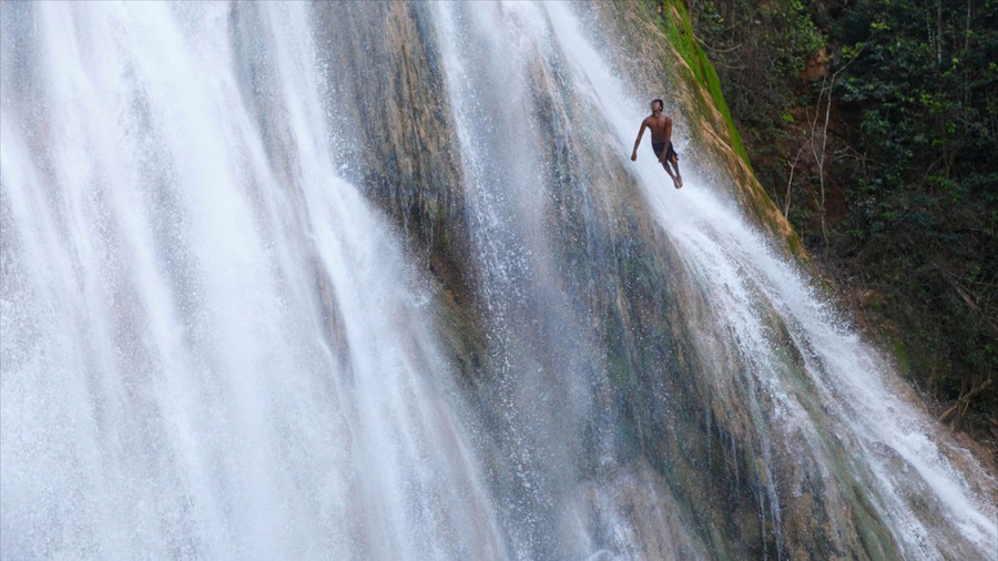 El Limon Falls featuring a cascade as well as an individual male