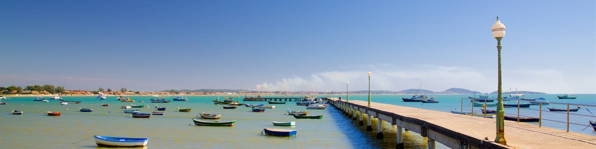 Manguinhos Beach showing a bay or harbor, a sandy beach and general coastal views