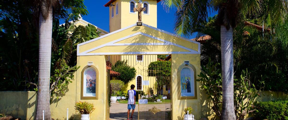 Chapel of Our Lady Desatanudos showing a church or cathedral as well as an individual male