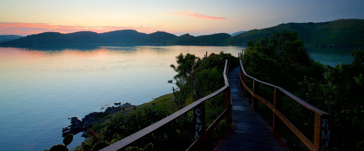 Arpoador Mount which includes a sunset and general coastal views