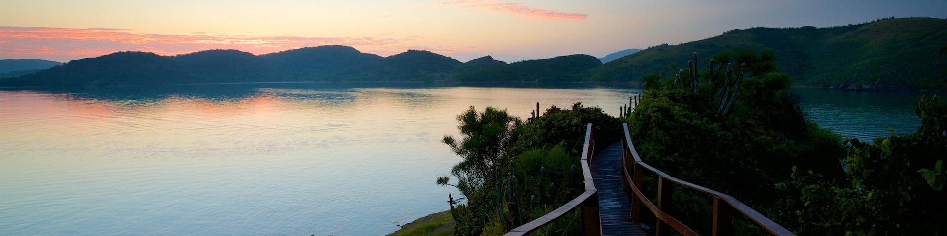 Arpoador Mount which includes a sunset and general coastal views