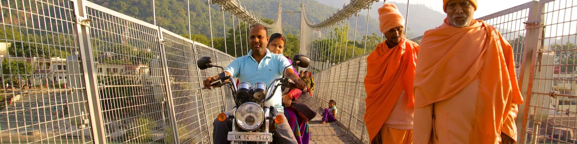 Ram Jhula showing a bridge, a small town or village and a river or creek