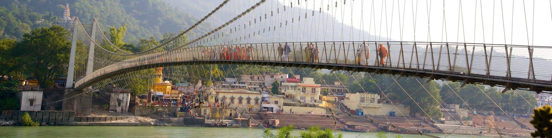 Ram Jhula showing a river or creek and a suspension bridge or treetop walkway