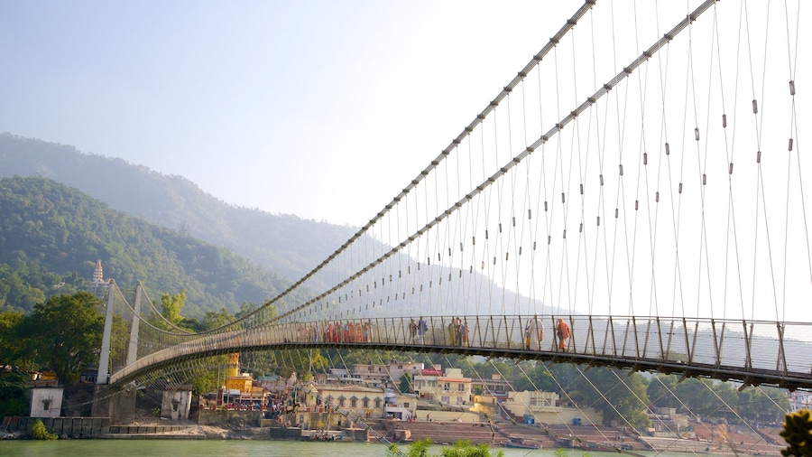 Ram Jhula showing a river or creek and a suspension bridge or treetop walkway